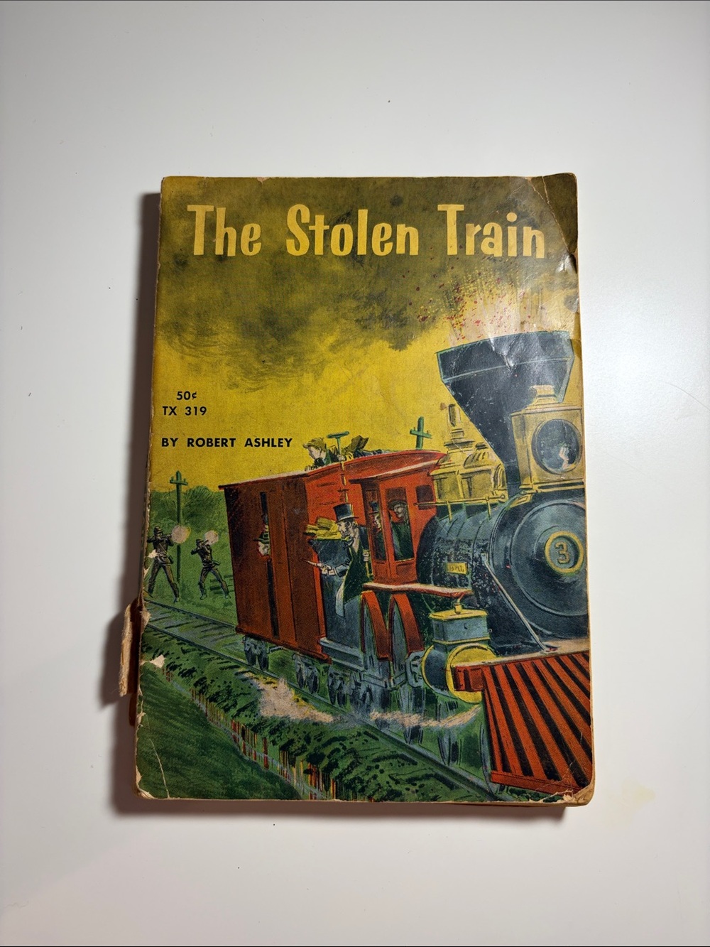 Vintage Scholastic Paperback Book “The Stolen Train” by Robert Ashley